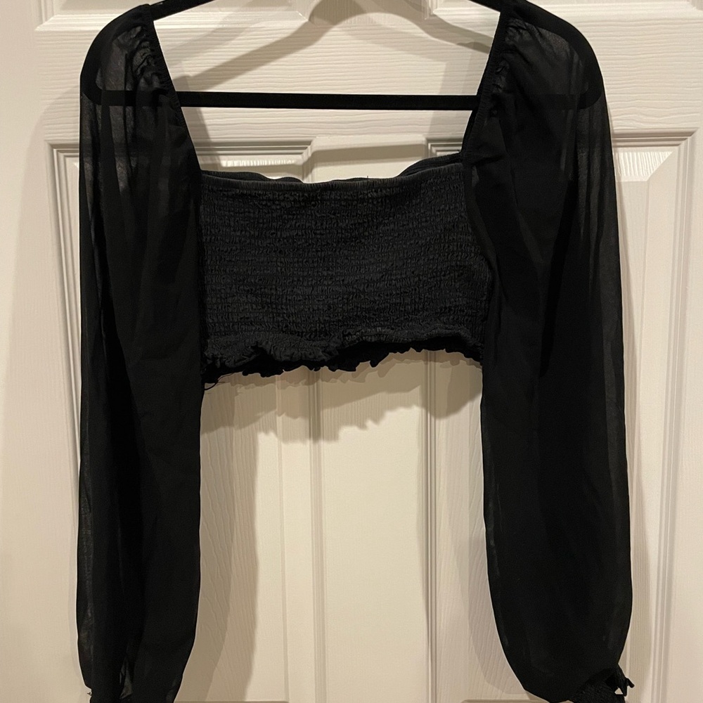 Black cropped long sleeve top, great condition, fits most sizes comfortably!